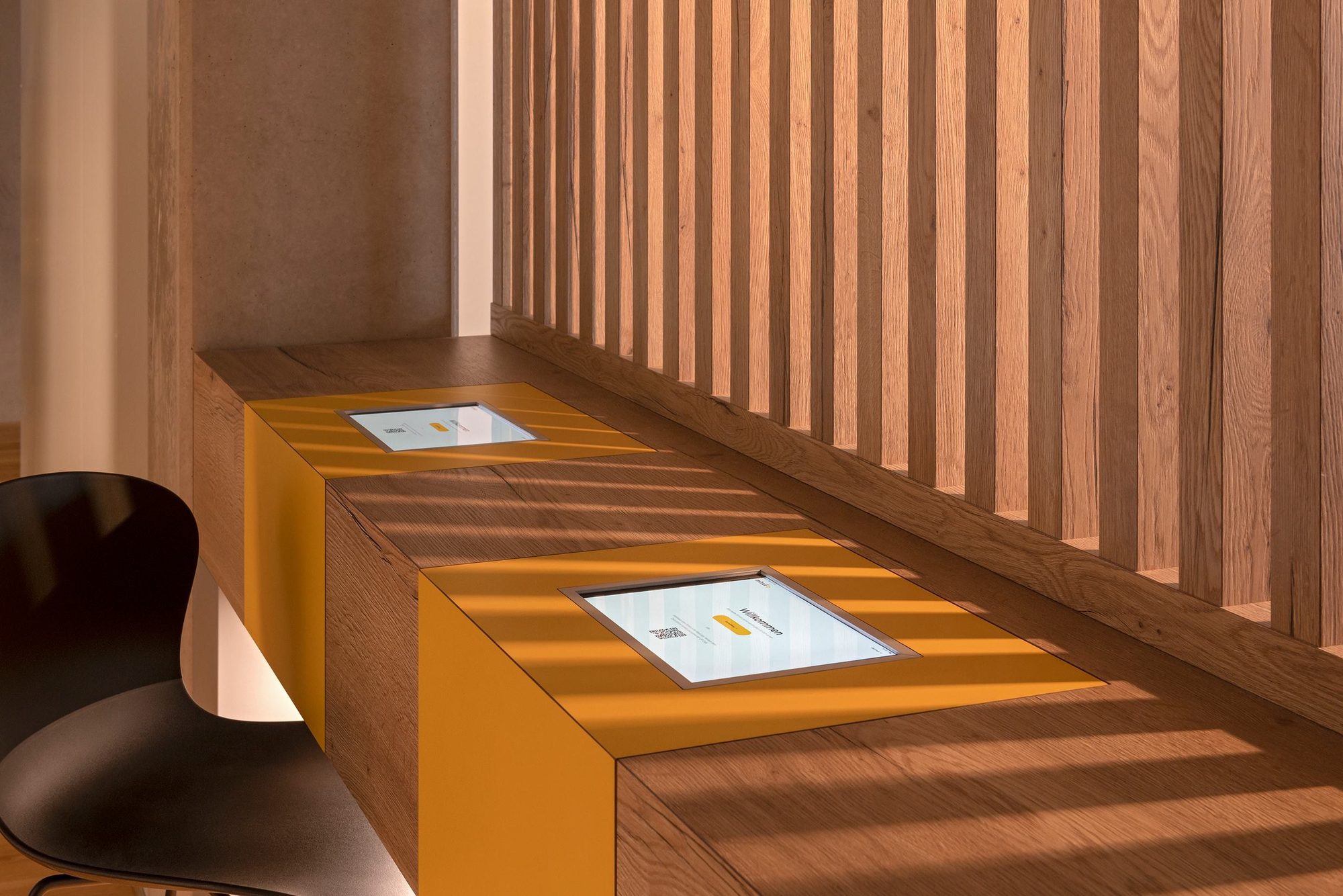 The self check-in tablet mounted in the warm wooden interior of the first Minxli clinic
