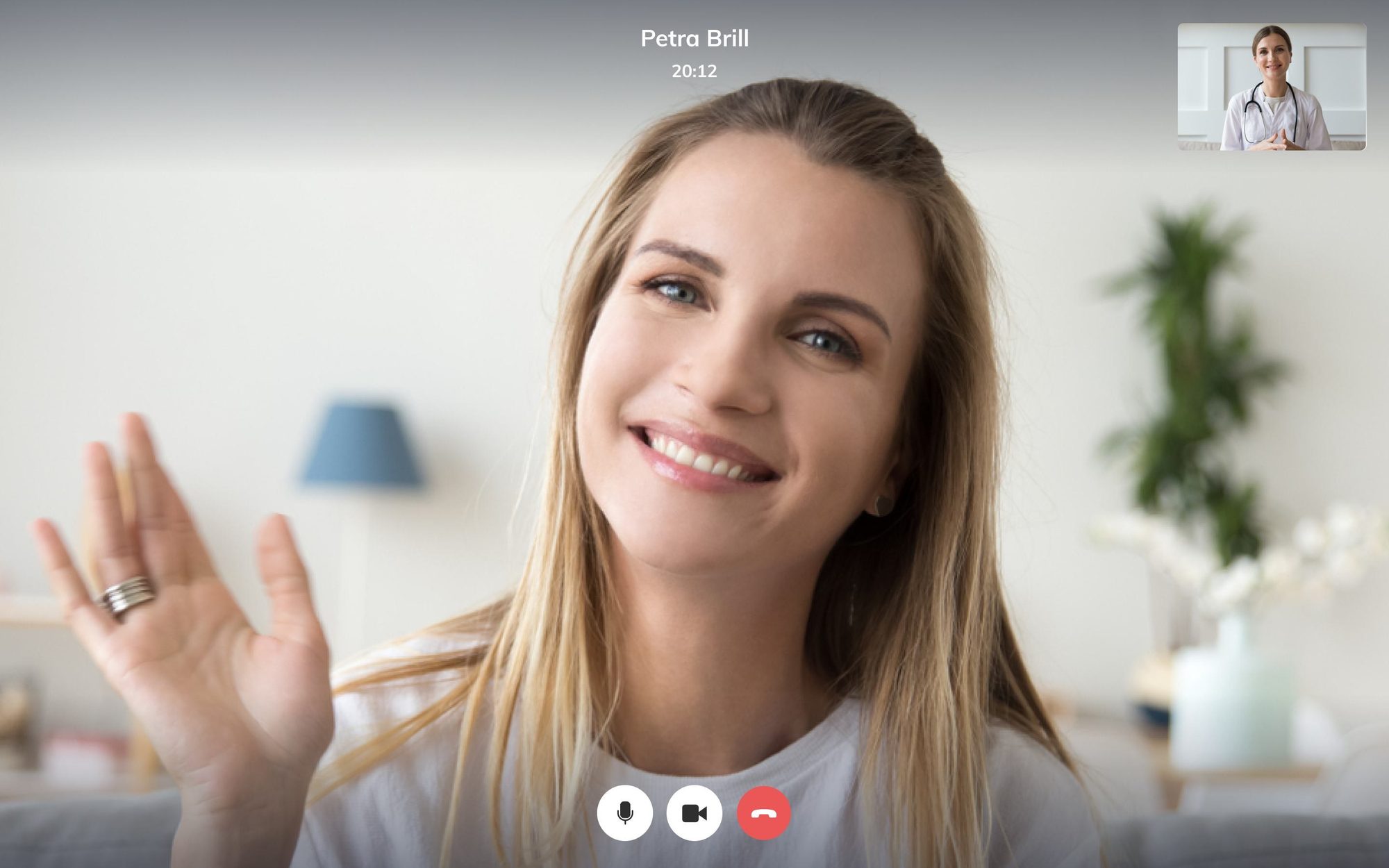 Online video consultation in progress: patient waving to her doctor on a video call