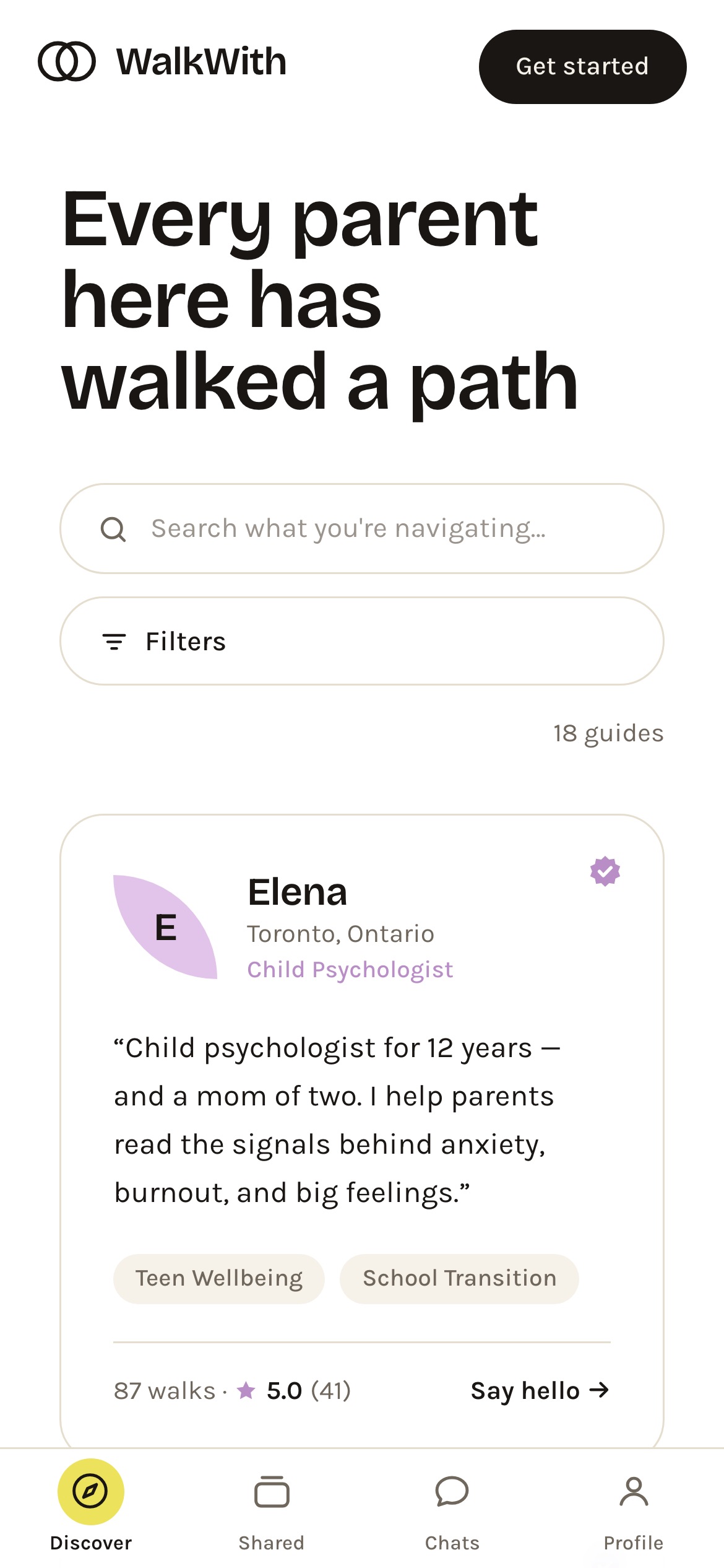 WalkWith on a phone — the Discover headline, search and filter controls, a full-width guide card, and a four-tab bottom bar: Discover, Shared, Chats, Profile